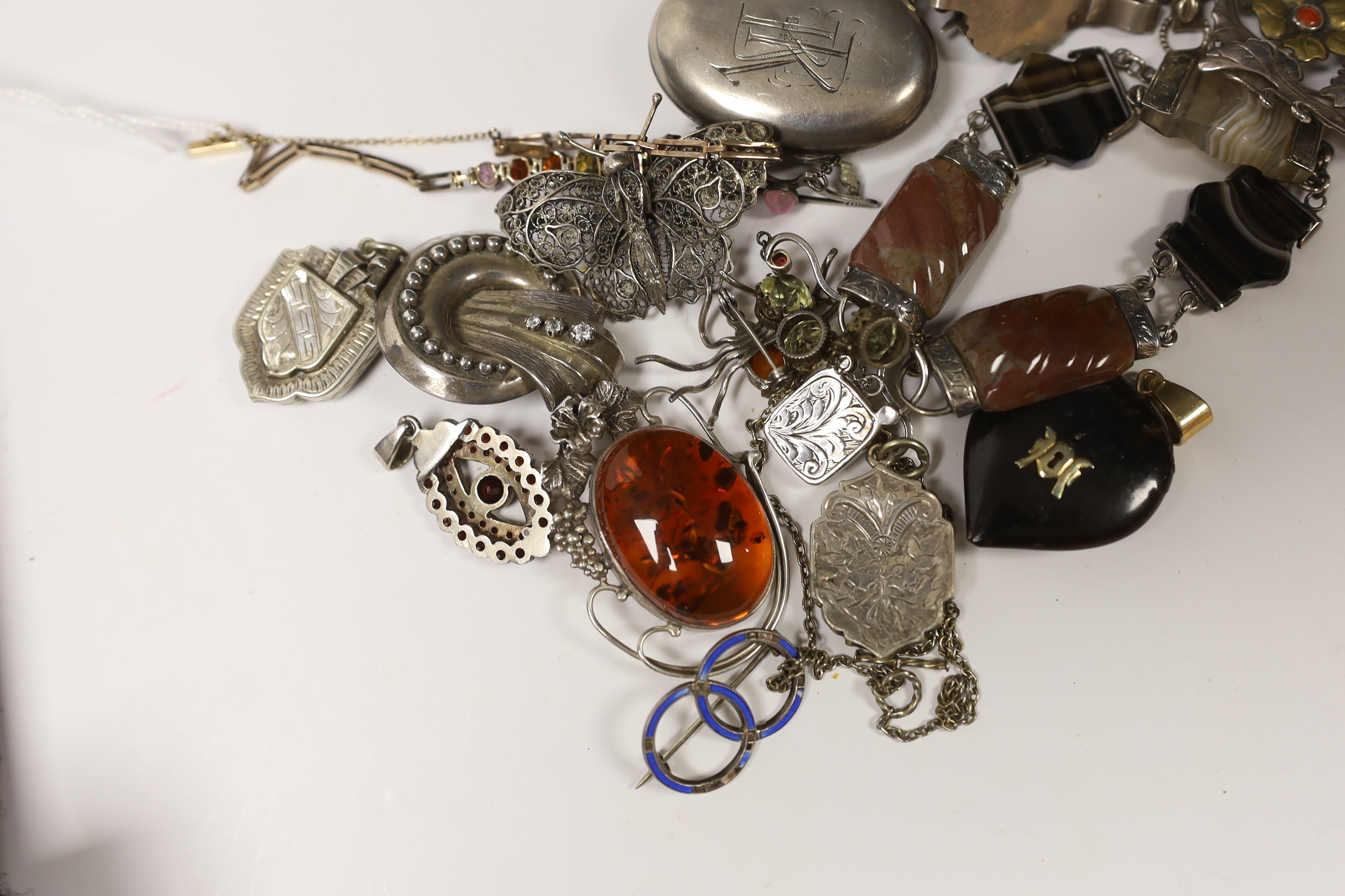 A small quantity of Victorian and later jewellery, including white metal and agate set bracelet, a yellow metal and graduated multi gem set bracelet (including zircon and garnet), lockets, brooches, etc.